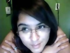 Cute nerdy brunette fucks herself with a dildo on webcam