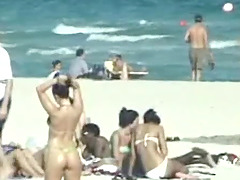 Spy at the topless beach films the boobs of sexy girls