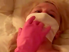 Masked blonde with rubber gloves masturbating
