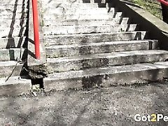 Sporty jogging brunette nympho pisses right on concrete steps