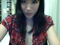 Quite naughty slender Asian girl flashes her tits on cam in the library