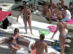 Boat party on a lake with lots of amateur flashers in bikinis