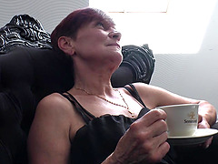 Slim redhead granny rubbing and fingering her aching cunt