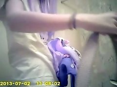 Spy cam vid of purple haired titless chick changing her clothes